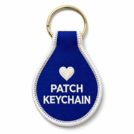Llave de parche - Llavero de parche bordado en forma de lágrima azul con borde blanco y llavero dorado dividido para personalización.
