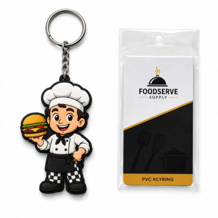 Llaveros de goma de mascota de chef de restaurante de marca sosteniendo una hamburguesa, presentados con una tarjeta de respaldo minorista personalizada.