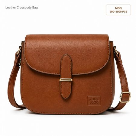 Custom private label leather crossbody bag in brown with gold hardware clasp for wholesale fashion supply.