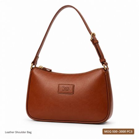 Customized leather shoulder bag baguette style with adjustable strap and embossed logo for retail brands.