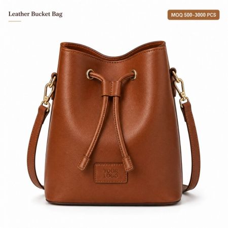 Custom leather bucket bag with drawstring closure and embossed brand logo for bulk corporate wholesale.
