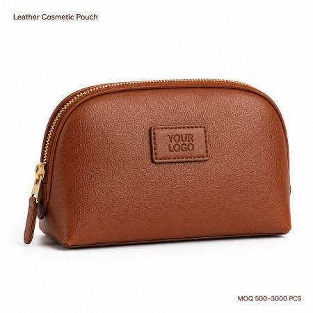 Custom brown leather cosmetic pouch with gold zipper closure for private label wholesale makeup bags.