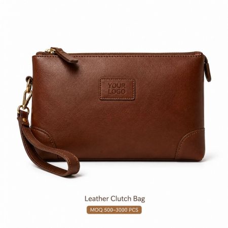 Wholesale custom leather clutch bag with wristlet strap and embossed logo for promotional merchandise.
