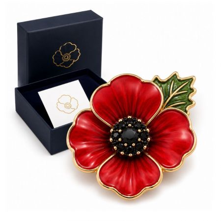 Gold-plated red enamel poppy brooch presented with a luxury navy blue custom jewelry gift packaging box.