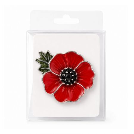 Silver rimmed red enamel poppy pin housed in standard clear plastic retail hanger packaging for wholesale supply.