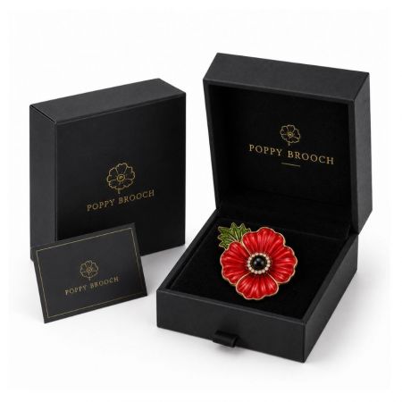 Red poppy flower brooch nestled in premium black velvet drawer gift box, high-end corporate commemorative jewelry.