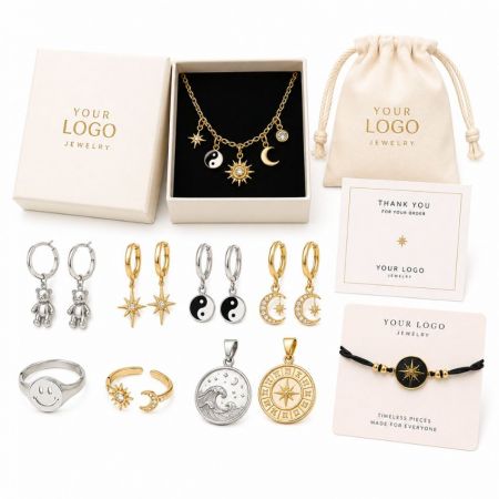 Wholesale custom logo jewelry collection featuring trendy ying-yang, star, and celestial enamel charms with pouches.