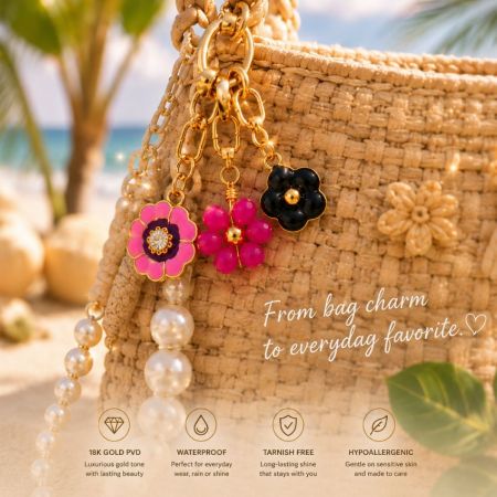 Colorful gold flower bag charms on a straw handbag, showcasing retail-ready luxury resort wear accessories.