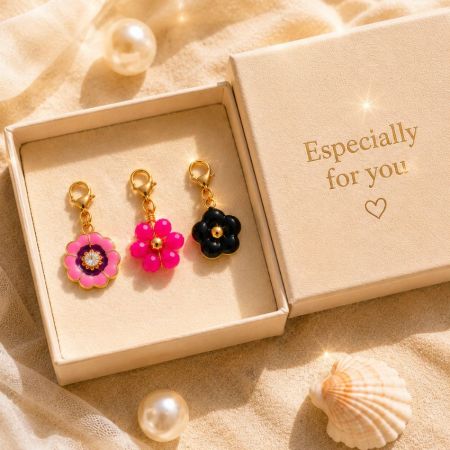 Three flower clip-on charms beautifully presented in a custom gift box, ideal for private label premium packaging.