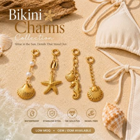 Stainless steel bikini charms collection on sand, highlighting low MOQ and OEM ODM manufacturing.
