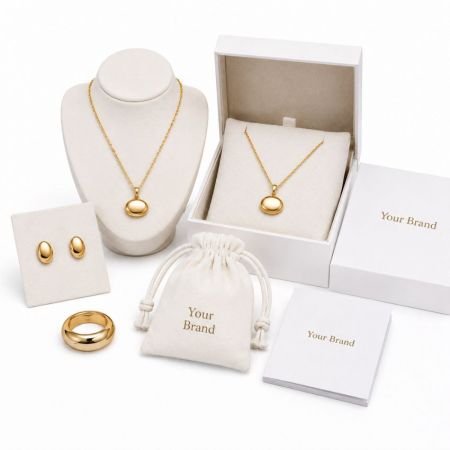Wholesale gold dome jewelry sets including necklaces, earrings, and rings with custom private label packaging.