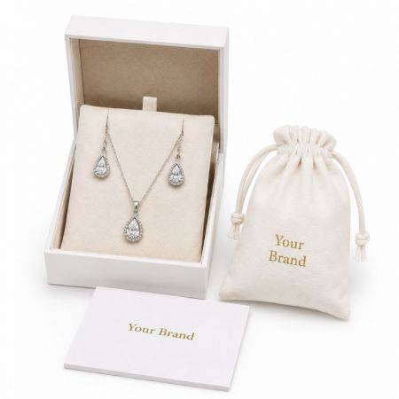 Silver teardrop CZ bridal jewelry sets in custom branded packaging, ideal for private label B2B wholesale.