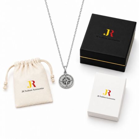 Silver compass pendant necklace with custom white label packaging. B2B wholesale jewelry manufacturing and OEM services.