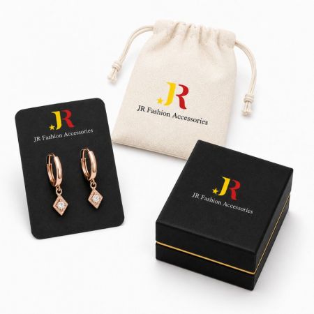 Rose gold drop hoop earrings with custom branded packaging, ideal for B2B white label jewelry manufacturing and wholesale.