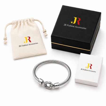 Silver twisted cable knot bracelet with custom branded B2B packaging. Ideal for white label jewelry wholesale and ODM.
