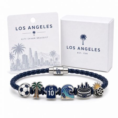 Los Angeles city charm bracelet in blue braided leather featuring custom enamel sports jersey and palm tree charms.