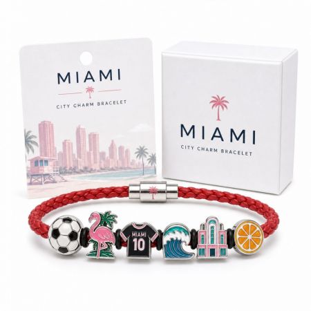 Miami city charm bracelet in red braided leather with custom enamel flamingo, jersey, and orange slice charms.