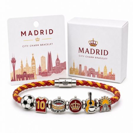 Madrid city charm bracelet in red and yellow leather with custom enamel stadium, crown, and guitar charms.