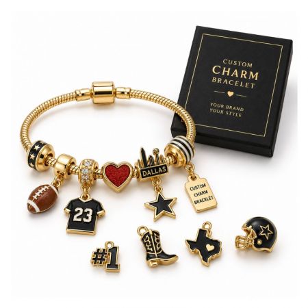 Custom gold football charm bracelet with black jersey and helmet charms next to a branded jewelry gift box.