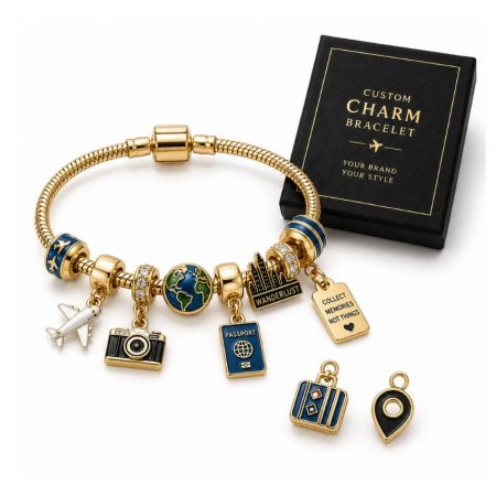 Custom travel charm bracelet with gold passport, globe, and camera charms displayed beside a premium black gift box.