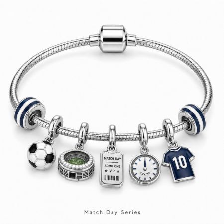 Match day series snake chain bracelet displaying a miniature stadium, VIP ticket, and kickoff clock charms.