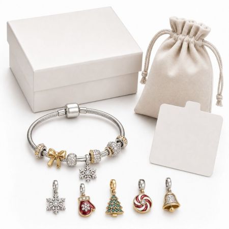 Charm It Bracelet - Custom Christmas charm bracelet with snowflake and mitten charms, white gift box, and pouch for wholesale packaging.