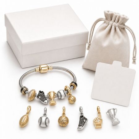 B2B wholesale sports charm bracelet featuring basketball and football charms, presented with premium gift packaging.