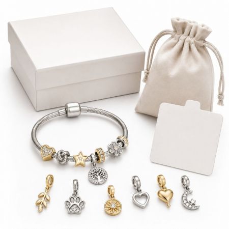 Silver tree of life charm bracelet with rhinestone paw print and star charms, perfect for custom jewelry brands.