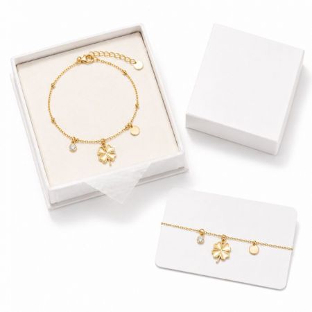 14K Charm Bracelet - Gold clover charm bracelet in a white gift box with display card, perfect for wholesale fashion jewelry suppliers.