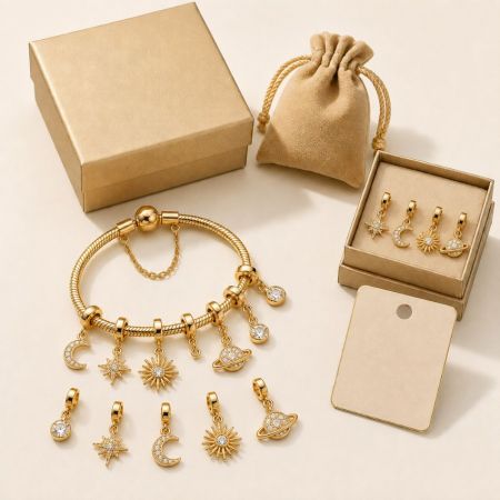 Gold Charm Bracelet - Gold celestial charm bracelet with star and moon pendants, displayed with custom jewelry gift box for wholesale supply.