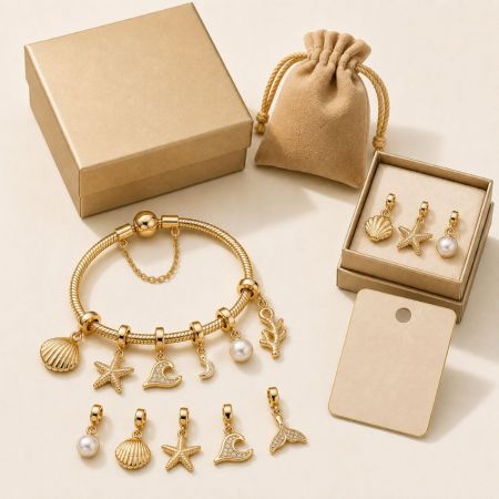 Ocean themed gold charm bracelet with starfish and pearl pendants, complete with elegant packaging options for sourcing.