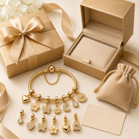 Premium gold charm bracelet gift set with luxury ribbon boxes, perfect for jewelry brands sourcing corporate gifts.