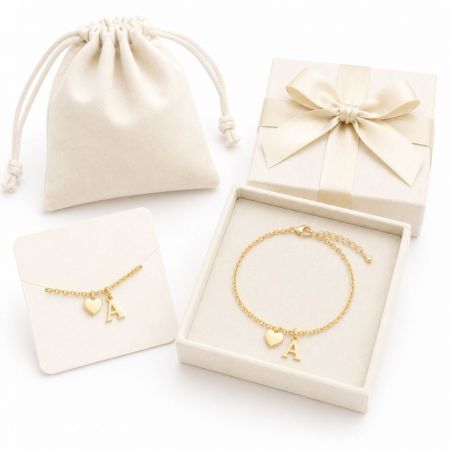 Gold thin chain bracelets featuring a heart and initial A charm with premium packaging, perfect for B2B sourcing.