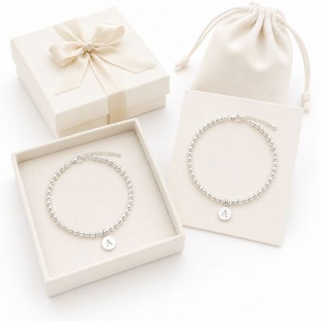 Silver beaded chain bracelets with round engraved letter A charms, perfect for premium gift merchandise sourcing.