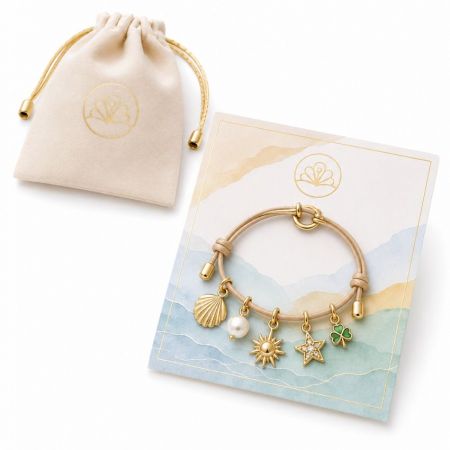 Charm Bracelets for Woman - Gold charm bracelet with pearl and seashell dangles, displayed on custom display card with velvet jewelry pouch.
