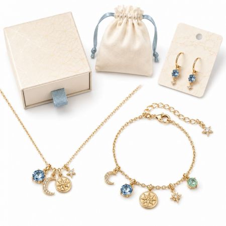 Gold celestial star and moon jewelry set including necklace, bracelet, and earrings for boutique sourcing.