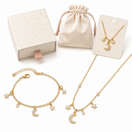 Gold star and crescent moon charm bracelet and matching necklace, perfect for custom jewelry suppliers.