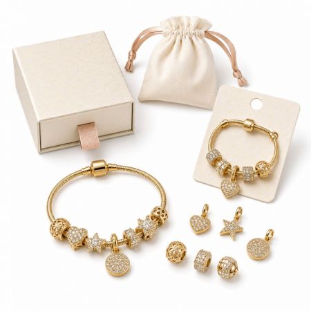 Gold European snake chain bracelet with sparkling crystal pave charms, suitable for bulk wholesale ordering.