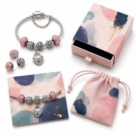 Silver European snake chain charm bracelet with pink crystal beads and heart lock pendant, including a bespoke gift set.