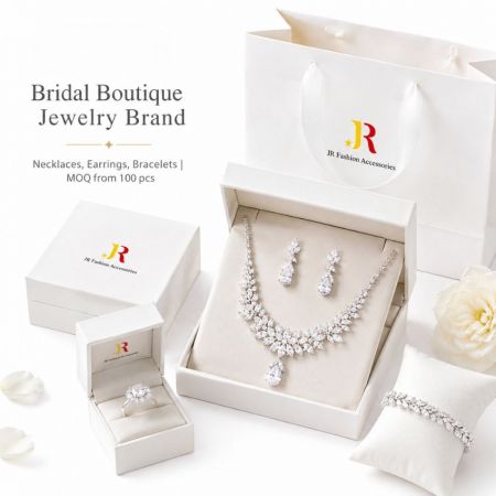 Bridal boutique jewelry set featuring cubic zirconia necklace, earrings, and ring with elegant packaging.