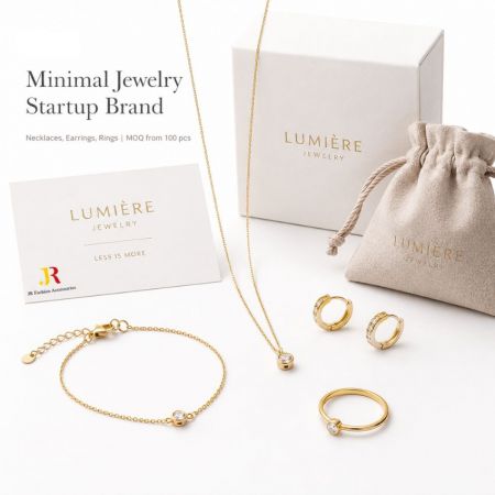 Minimalist gold jewelry set with branded card, box, and pouch, ideal for custom startup brand launch.