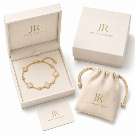 Gold clover bracelet in custom branded box and pouch. JR Fashion Accessories private label wholesale.