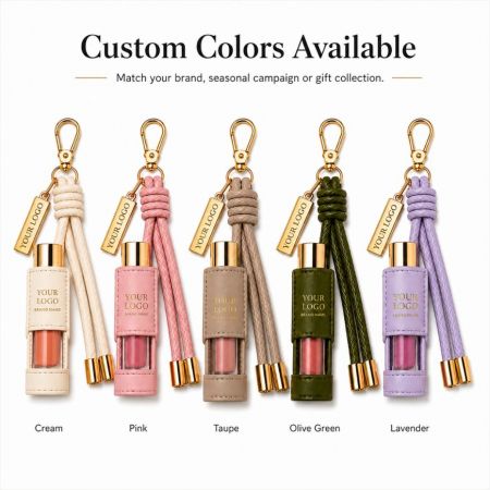 Custom PU leather lipstick holder keychains shown in cream, pink, taupe, olive green, and lavender colors for wholesale.