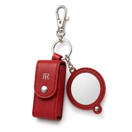 Red leather lipstick holder keychain with a round mirror charm and snap closure for OEM branding.