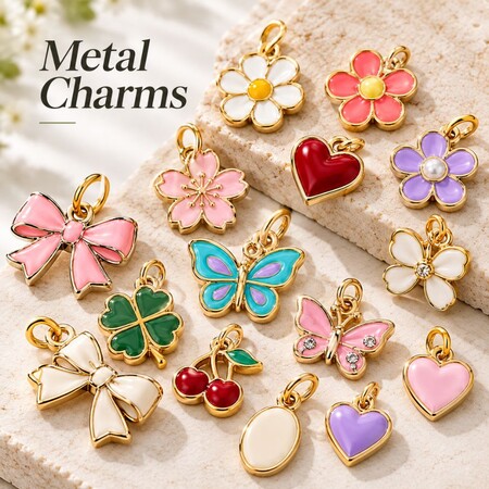 Variety of wholesale enamel metal charms including flowers, butterflies, and bows for custom keychains.
