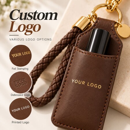 Custom logo options on leather mascara keychain sleeve including foil stamping, debossing, and printing.