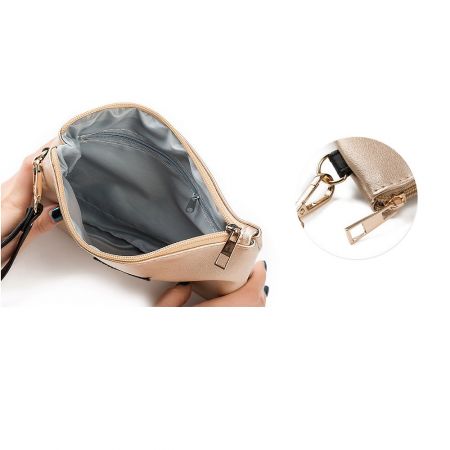 Interior view of the sparkly star clutch bag showing the gray lining and gold zipper detail.