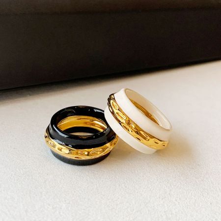 Brass Vintage Double-Color Enamel Rings - A set of vintage-style brass rings with double-color enamel, one in black and gold, the other in white and gold, displayed side-by-side.