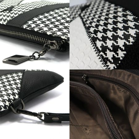 Open clutch bag displaying the spacious interior and brown lining.