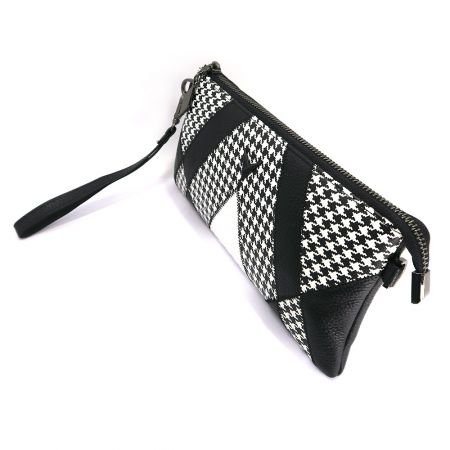 Angled view of the patchwork clutch bag.